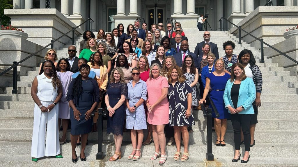 Stillbirth prevention advocates from Healthy Birth Day, Inc. and other organizations stand on the steps of the Capitol building in Washington, D.C.