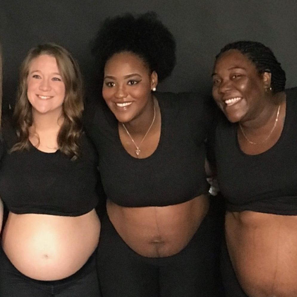 A group of pregnant women show off their baby bumps