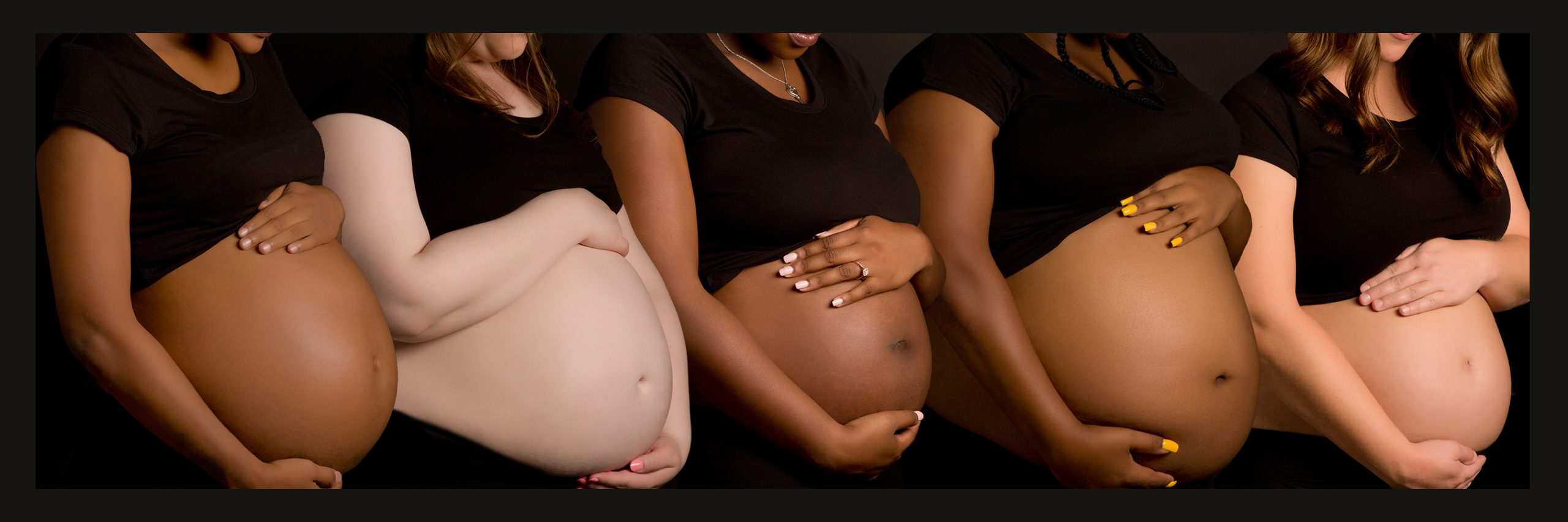 A diverse group of expectant moms show their pregnant bellies