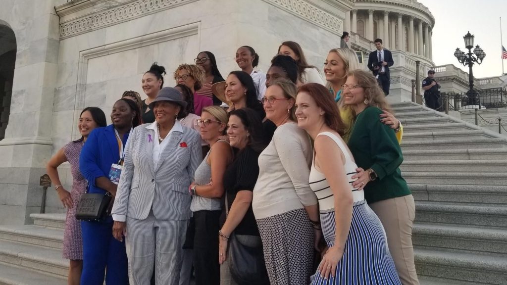 Stillbirth prevention advocates stand on the steps of the Capitol with Congresswoman Alma Adams